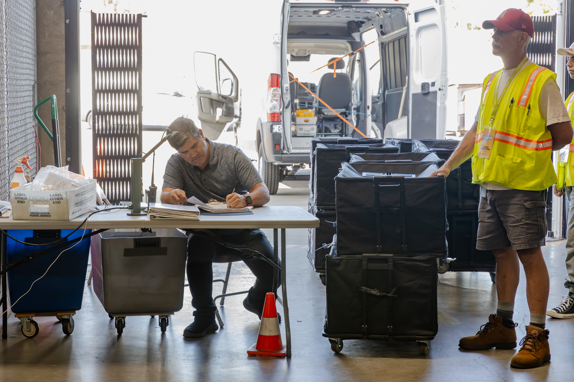 county election office staff counting ballots